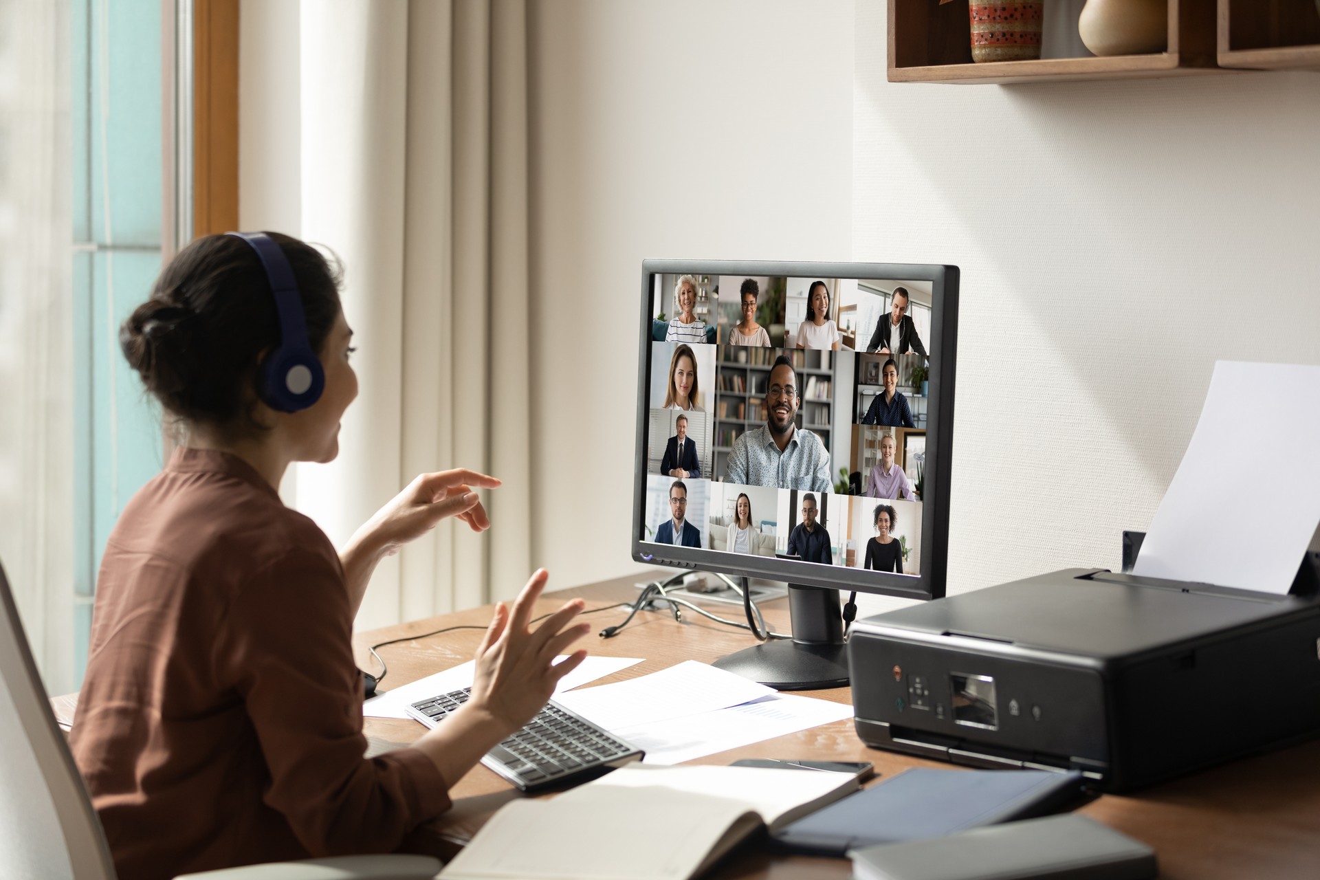 Smiling woman have webcam online meeting on computer